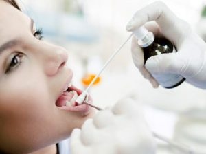 Patient receiving local anesthetic prior to dental implants in Oregon