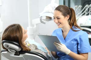 a dental technician discusses options to be put to sleep for dental implant surgery