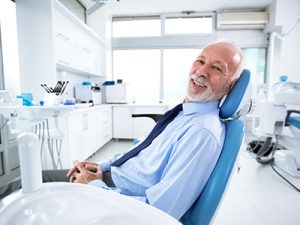 Man asks questions about same day denture procedure including “can dentures be made in one day?”